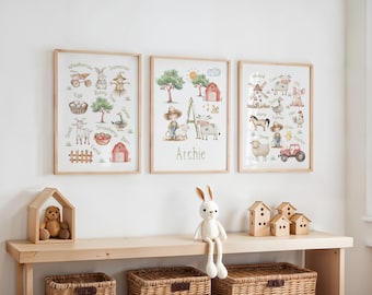 May include: Three framed watercolor farm animal prints. The prints feature illustrations of a wheelbarrow, bunny, scarecrow, goat, goose, strawberry, barn, windmill, cow, duck, pig, horse, sheep, tractor, and more. The middle print has the name "Archie" below the illustration.