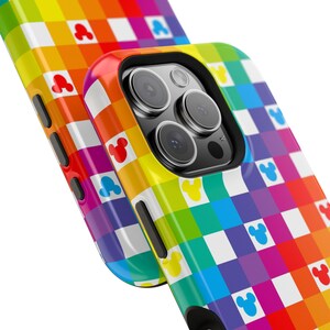 May include: A colorful phone case with a rainbow checkered pattern and Mickey Mouse icons. The case is a vibrant mix of red, orange, yellow, green, blue, and purple. The phone case has a glossy finish and a camera cutout.