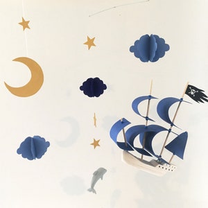 Mobile for baby pirate ship in the middle of the clouds of the stars and the moon fimo wood and paper