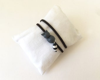 Raccoon bracelet for children in gray, black and white fimo and brown suede