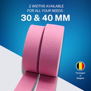 May include: Pink fabric rolls with the text "2 WIDTHS AVAILABLE FOR ALL YOUR NEEDS: 30 & 40 MM". The product is packaged in Belgium. The fabric is available in 30 mm and 40 mm widths.