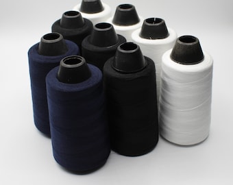 12  cones of Overlock Yarn 4xwhite 4xblack 4xnavy  2200mt x 12