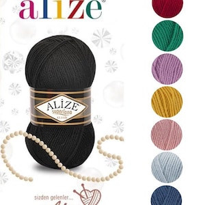 May include: A ball of black yarn with the Alize Superlana Klasik label. The yarn is surrounded by a string of white beads. The image also shows a color chart with 9 different colors of yarn.