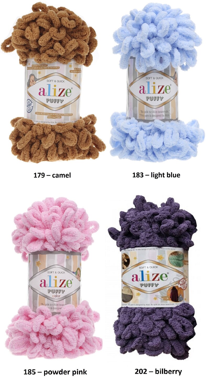 May include: Four skeins of Alize Puffy yarn in different colors: camel, light blue, powder pink, and bilberry. Each skein has a label with the Alize logo and the words "Soft & Quick" and "Puffy".