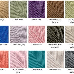 May include: A color chart of yarn samples in various shades of beige, green, purple, brown, blue, grey, pink, teal, and white. The yarn samples are arranged in a grid pattern with the color name and number listed below each sample.