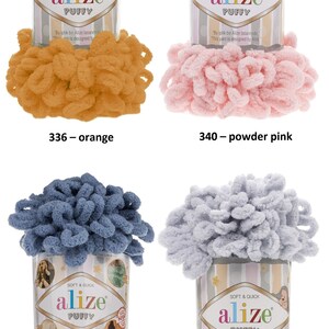 May include: Four skeins of yarn in different colors: orange, powder pink, blue, and grey. The yarn is fluffy and textured. The label on each skein reads "alize puffy" and includes the text "Soft & Quick".