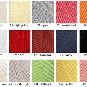 May include: A color chart showing 12 different yarn colors. The colors are: cream, light yellow, grey, mussel shell, orange, white, red, bordeaux, navy, black, light cream, candle light, pistachio, yellow, and salmon.