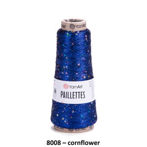 May include: A spool of blue yarn with iridescent sequins, labeled "YarnArt Paillettes 8008 - cornflower"