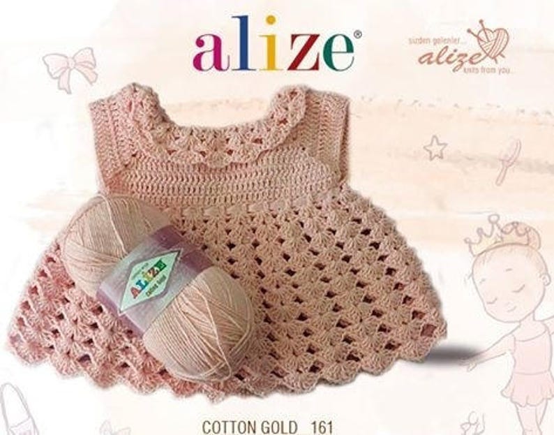 May include: A pink crocheted baby dress with a scalloped neckline and a ball of yarn labeled "Alize Cotton Gold 161".
