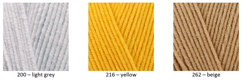 May include: Three skeins of yarn in different colours: light grey, yellow, and beige. The yarn is displayed in a close-up view, showing the texture and colour of the yarn.