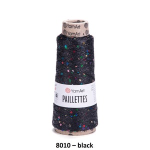 May include: A spool of black yarn with colorful sequins, labeled "YarnArt Paillettes 8010 - black".