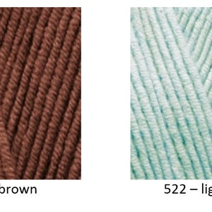 May include: Two yarn samples, one brown and one light aqua. The yarn is textured and has a subtle sheen. The yarn samples are labelled with their corresponding colour numbers and names: 493 - brown and 522 - light aqua.