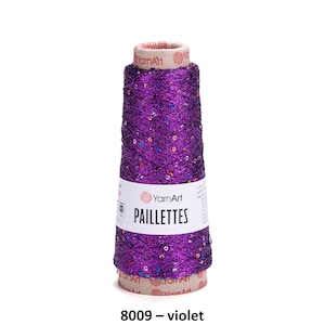 May include: A spool of purple yarn with sequins, labeled "YarnArt Paillettes 8009 - violet"