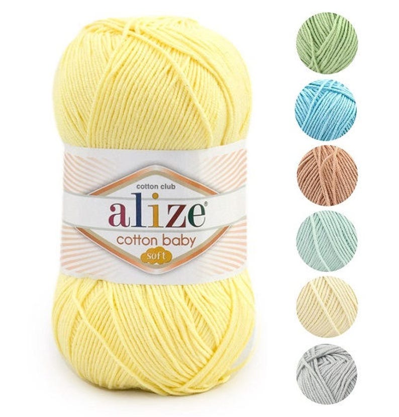 May include: A ball of yellow cotton yarn with the label "alize cotton baby soft" and the words "cotton club" above the brand name.