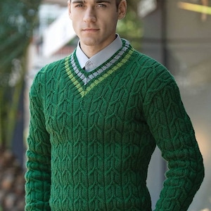 May include: A green cable knit sweater with a v-neck and white and green stripes around the neck and bottom hem.