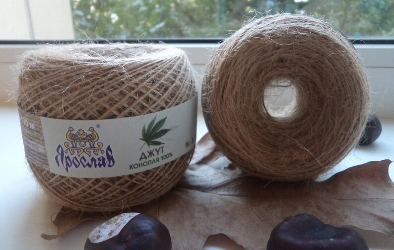 May include: Two spools of natural brown twine, one with a label that reads "Джут Конопля 100%" and "Ярославль".