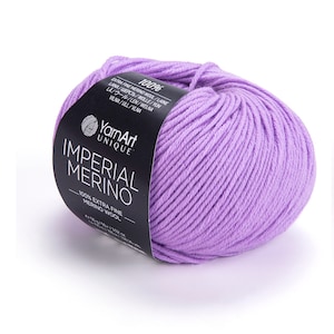 May include: Three balls of yarn in different shades of purple and pink. The yarn is labelled "Imperial Merino" and is made by "YarnArt Unique".