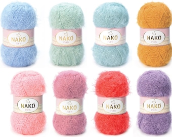 May include: Eight balls of yarn in various colors, including light blue, green, orange, pink, red, and purple. Each ball has a white label with the text "NAKO Paris" printed on it.