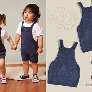 May include: Two children wearing blue knitted overalls. The overalls have pockets and are made with a blue yarn. The yarn is labeled "Superlana Klasik 591".