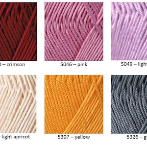 May include: Six skeins of yarn in different colors: crimson, pink, light pink, light apricot, yellow, and gray. The yarn is arranged in two rows of three skeins each.