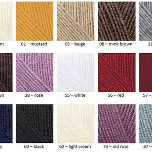 May include: A color chart of yarn samples in various shades of cream, mustard, beige, brown, grey, rose, white, red, burgundy, navy, black, light cream, old rose, and coal grey.