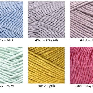 May include: Six skeins of cotton yarn in various colors: blue, gray ash, lilac, mint, yolk, and raspberries. Each skein is labeled with a number and color name.