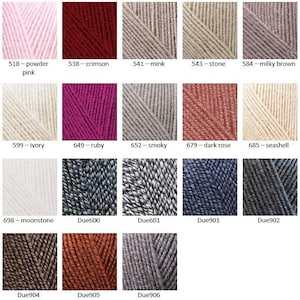 May include: A color chart of yarn samples in various shades of pink, red, beige, gray, and brown. The yarn samples are arranged in a grid pattern with the color names and numbers listed below each sample.