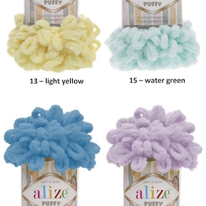 May include: Four skeins of Alize Puffy yarn in different colors: light yellow, water green, sochi blue, and light lilac. Each skein is labeled "Alize Puffy" and "Soft & Quick".