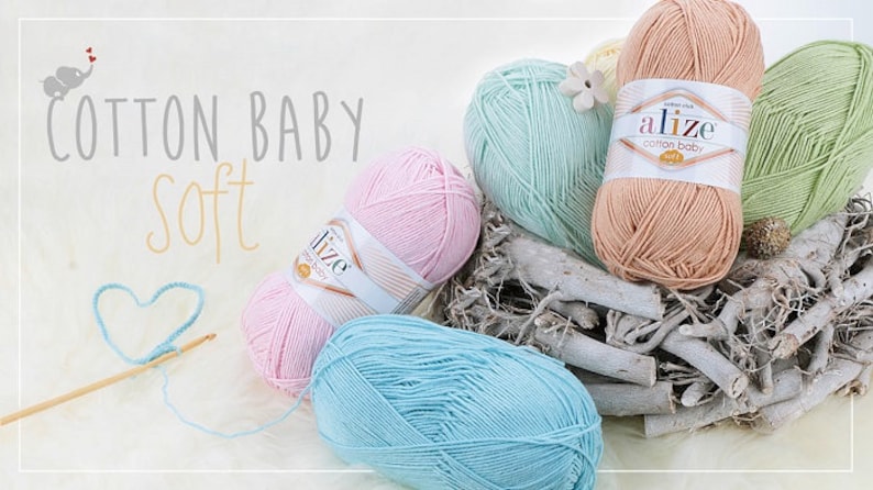 May include: Four balls of yarn in pink, light blue, peach, and green. The yarn is labeled "Alize Cotton Baby Soft".