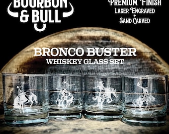 May include: A set of four clear glass whiskey tumblers featuring white laser-engraved and sand-carved illustrations of a cowboy riding a bucking bronco. The text BOURBON & BULL, PREMIUM FINISH, LASER ENGRAVED + SAND CARVED, and BRONCO BUSTER WHISKEY GLASS SET is visible.