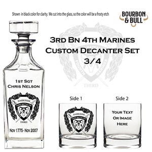 May include: A custom decanter set for 3rd Battalion, 4th Marines. The set includes a decanter and two glasses. The decanter is engraved with the words "1st Sgt Chris Nelson" and "Nov 1775-Nov 2007". The glasses are engraved with the words "Darkside Third Battalion" and "3/4".