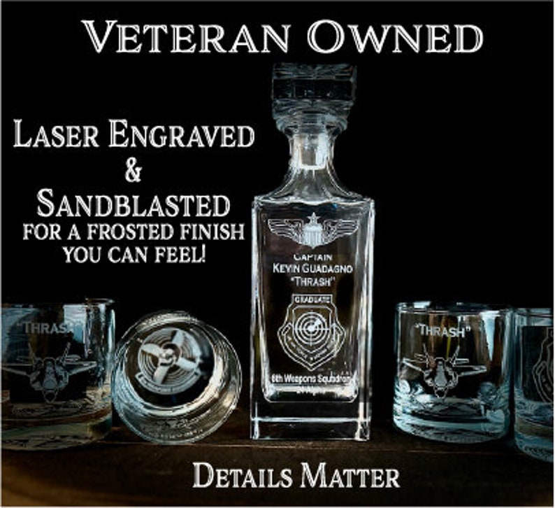 May include: A clear glass decanter with a frosted finish and laser engraved text. The text reads "Captain Kevin Guadagno "Thrash" Graduate 6th Weapons Squadron". The decanter is surrounded by three clear glass tumblers with frosted finishes and laser engraved text. The text on the tumblers reads "Thrash". The image has the text "Veteran Owned" at the top and "Laser Engraved & Sandblasted for a frosted finish you can feel!" at the bottom. The image also has the text "Details Matter" at the bottom.