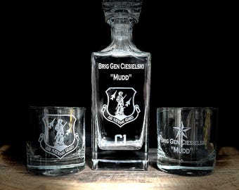 May include: A crystal decanter and two matching glasses engraved with the text "Brig Gen Ciesielski "Mudd"  Air National Guard" and a star.