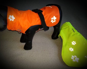 Dog safety paw print jacket. Dog high visibility jacket. Dog padded coat. Dog waterproof coat. Dog walking jacket. Neon jackets for dogs.