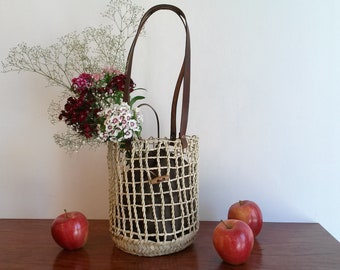 Round handbag in palm rope braided in net, rigid, brown leather handles, summer handbag, button closure, S, M, L.