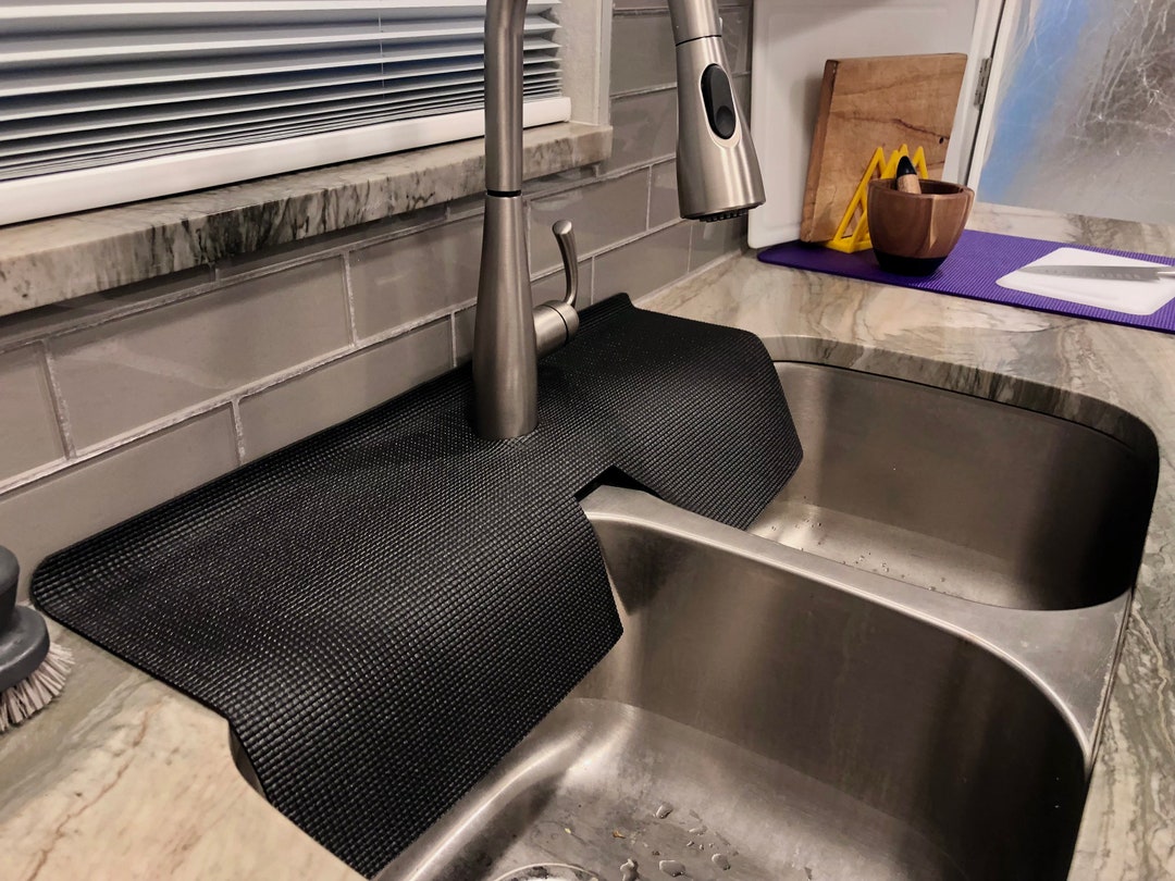kitchen sink splash guard behind faucet