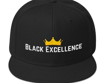 May include: Black baseball cap with a gold crown and the text "BLACK EXCELLENCE" embroidered in white.