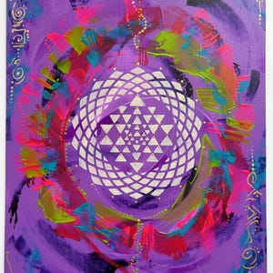 May include: Abstract painting on canvas with a white geometric design in the center. The background is purple with splashes of pink, green, and blue paint. The artist's signature, "Jodi Robbin", is in the bottom right corner.