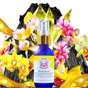 May include: A blue glass bottle with a gold cap and a yellow label. The label has the text "Manipura™" and "Hawaiian Fuences" on it. The bottle is surrounded by yellow, white, and pink flowers.