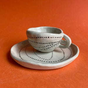 Ceramic spotty tea cup and saucer