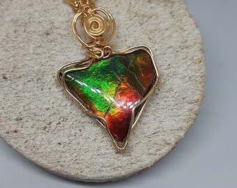 Awesome color ammolite from Alberta Canada. a rare gem stone from Canada with OOAK design wrapped in non tarnish gilt wire