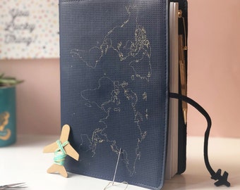 Stitch where you've been! Travel Notebook in vegan navy leather with gold world map and needle & thread