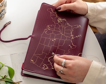 USA Stitch where you've been across the United States! Travel Notebook in Maroon vegan leather with gold map and needle & thread