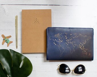 Stitch where you've been! Travel Notebook in navy leather with gold world map and needle & thread