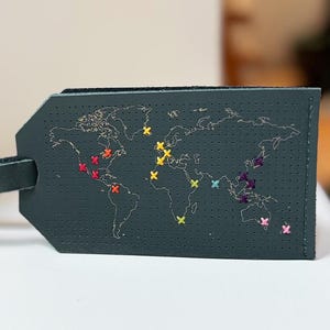 Stitch Where You&#39;ve Been Vegan Leather Luggage Tag - Black comes with gold & metallic red threads