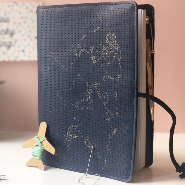 Stitch where you've been! Travel Notebook in vegan navy leather with gold world map and needle & thread