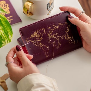 Stitch where you've been Travel Passport Cover Maroon with Gold world map, Real Leather Holder with needle & thread image 1