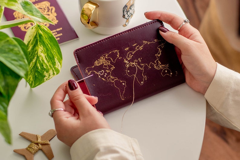 Stitch where you've been Travel Passport Cover Maroon with Gold world map, Real Leather Holder with needle & thread image 1