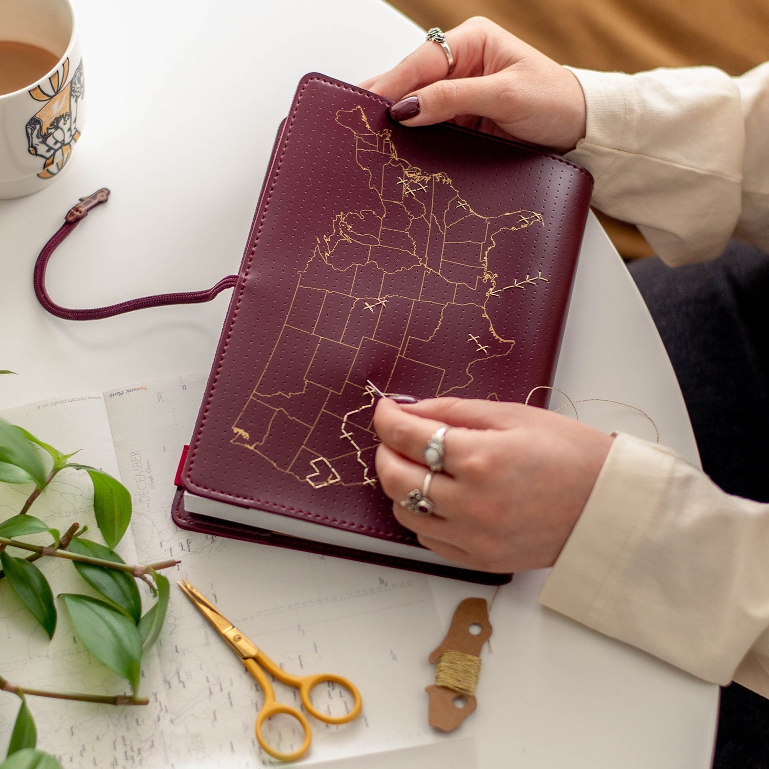 USA Stitch where you&#39;ve been across the United States! Travel Notebook in Maroon vegan leather with gold map and needle & thread
