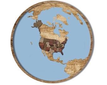 May include: A wooden globe map with a light blue background, showing the United States of America in detail. The globe is surrounded by a wooden frame.